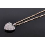 A fine quality large diamond encrusted heart shaped pendant and chain, circa 1940s/50s,