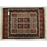 A red ground Persian rug with geometric pattern, 6'4" x 3'11".