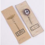 A German Third Reich enamelled lapel badge "Deutschland Erwache" and another gilt metal lapel