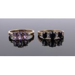 2 9ct gold stone set rings.