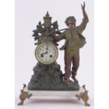 A French patinated spelter cased mantel clock surmounted by a figure of a boy,