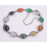 A polished multi-colour gemstone set bracelet, silver settings.