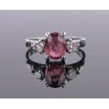 An 18ct white gold ruby and diamond 3 stone ring, total diamond content approx. 0.