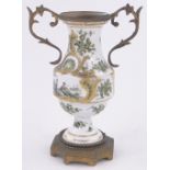 A 19th century continental porcelain and ormolu vase, painted and gilded designs, height 16cm, a/f.