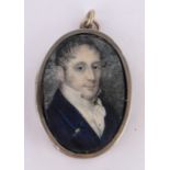 A miniature watercolour portrait of a gentleman, in unmarked gilt metal frame, height 40mm.