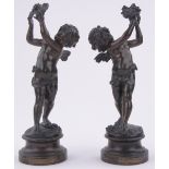 After Auguste Moreau- a pair of 19th century bronze-patinated spelter cherubs, turned wood plinths,