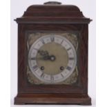 An Empire Georgian style walnut cased mantel clock, with brass carrying handle, height 28cm.