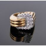 An 18ct gold diamond set buckle design ring, size N, gross weight 10g.