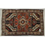 A red and cream ground Caucas design rug, 6'4" x 4'.