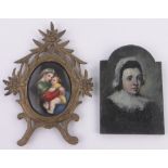 A painted porcelain plaque depicting a woman and child, carved giltwood foliate frame,