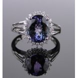 A 14ct white gold tanzanite and diamond cluster ring, tanzanite approx. 3.