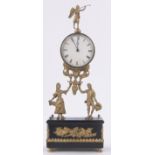 A 19th century French brass cased dial clock, supported by harvest figures, height 41cm.