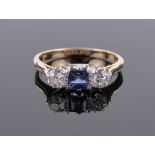 An 18ct gold sapphire and diamond 3 stone ring, total diamond content approx. 0.65cts, size K.