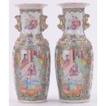 A pair of Chinese Famille Rose porcelain vases, with raised dragons, height 25cm.