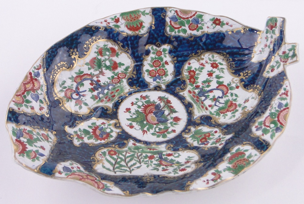 An early Worcester porcelain leaf shaped dish, with painted and gilded botanical designs,