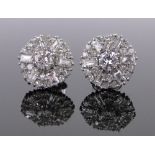 A pair of platinum diamond cluster earrings, round, brilliant and baguette-cut diamonds,