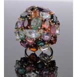 A large multi-colour gemstone set bombe shaped ring, unmarked gold settings, setting width 27mm,