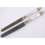 Pair of French mother of pearl and silver gilt handled knives, steel blades with French marks,