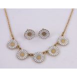 A Georg Jensen daisy pattern silver gilt necklace, and matching earrings, boxed.