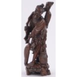 A Chinese carved hardwood fisherman circa 1900, height 48cm.