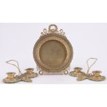 A 19th century gilt bronze photo frame, diameter 14cm and a pair of gilt metal twin candle stands,