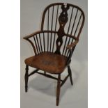 A 19th century yew and elm seated bow arm Windsor elbow chair.