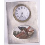 An Edwardian silver cased travelling clock, with painted panel on porcelain depicting a game bird,