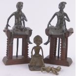 Pair of African Benin bronze seated tribal figures, on hardwood stools,