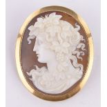 A carved shell Cameo brooch, classical portrait of a woman, 15ct gold frame, height 50mm,