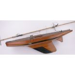 A scratch-built wooden hulled Vintage pond yacht, with mask, length 90cm.