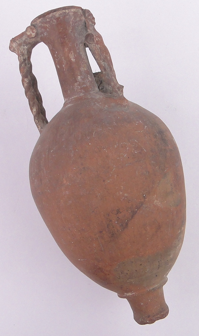 An Ancient terracotta narrow necked amphora, possibly Etruscan, lacking base, height 34cm.