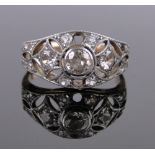 An 18ct gold diamond set Art Deco ring, open work settings, total diamond content approx. 0.8-0.