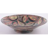 A Studio Pottery bowl by Sophie McCarthy, with painted abstract leaf designs, signed under base,