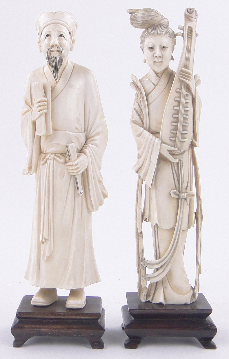 Pair of Chinese carved ivory Okimono figures, a female musician and a Sage,