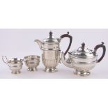 A 4-piece silver teaset of half fluted circular form, by Walker & Hall, Sheffield 1934, 40 oz.