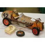 An early tinplate racing car.