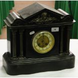 A slate cased mantel clock with brass mounts and 2-train movement.