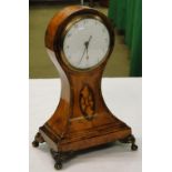 An Edwardian inlaid balloon cased small mantel clock.