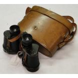 A pair of leather cased 8 x 30 extra wide angled binoculars by Barr and Stroud.