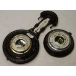 Antique wall barometer in carved wood case, with thermometer and a small circular barometer.