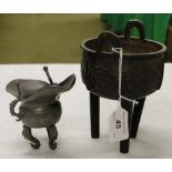 A Chinese bronze censer on tripod supports with script decoration, a Chinese pewter pot.