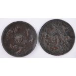 Two 19th century circular copper plaques, with relief embossed classical designs, one signed P