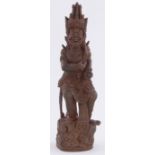 An Oriental carved & stained wood figure of a god, height 13"