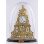 An ornate 19th century French gilt metal cased mantel clock, surmounted by a figure in armour,