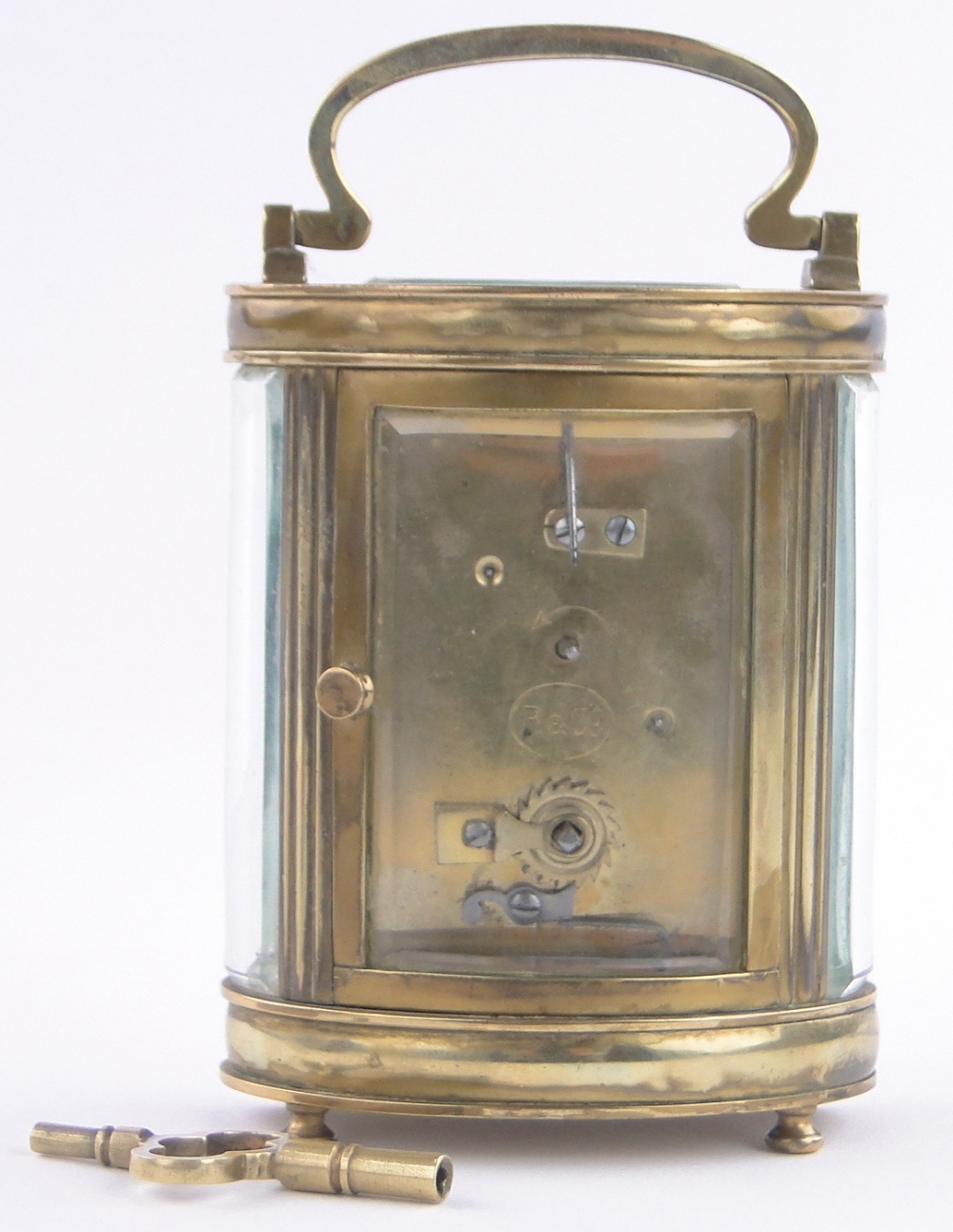 A French oval brass cased carriage clock, enamel dial, retailer Waring & Gillow, London, height - Image 2 of 3