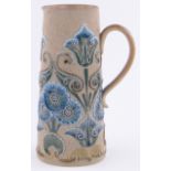 A Victorian Doulton Lambeth Pottery jug of tapered form, relief decorated with stylised flowers,