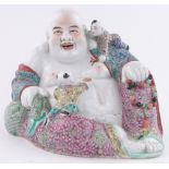 A Chinese porcelain seated Buddha with children, with enamelled clothing, impressed marks under