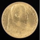 A 1933-34 Vatican City Papal gold 100 Lire coin, depicting Pope Pius XI, 8.8g.
