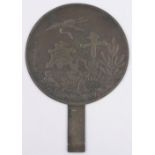 A Chinese bronze hand mirror, with relief cast heron and text, diameter 20cm.