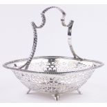 An Asprey's Edwardian silver fruit basket, with cast shaped handle and pierced fretwork surround,